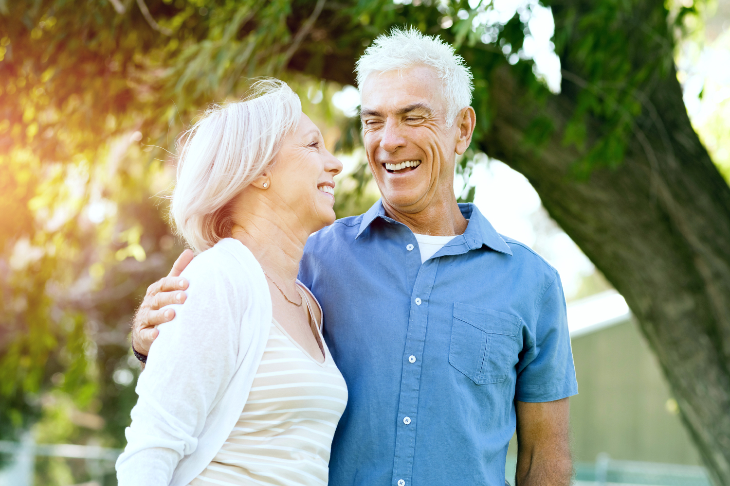 a man and a woman smiling for the camera