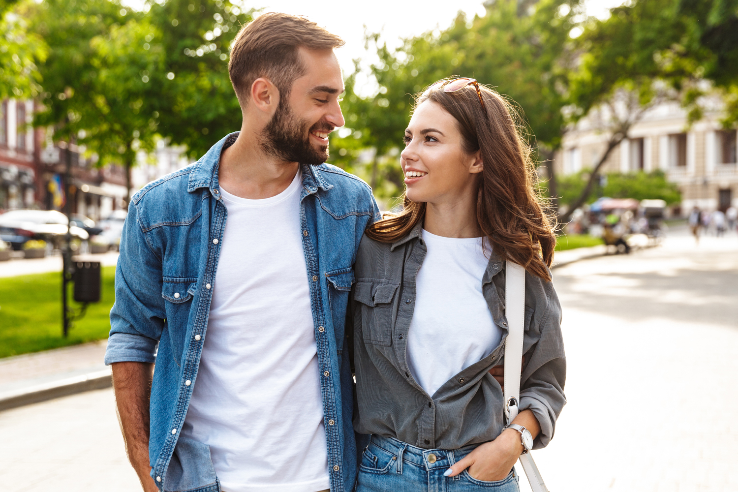 a man standing next to a woman