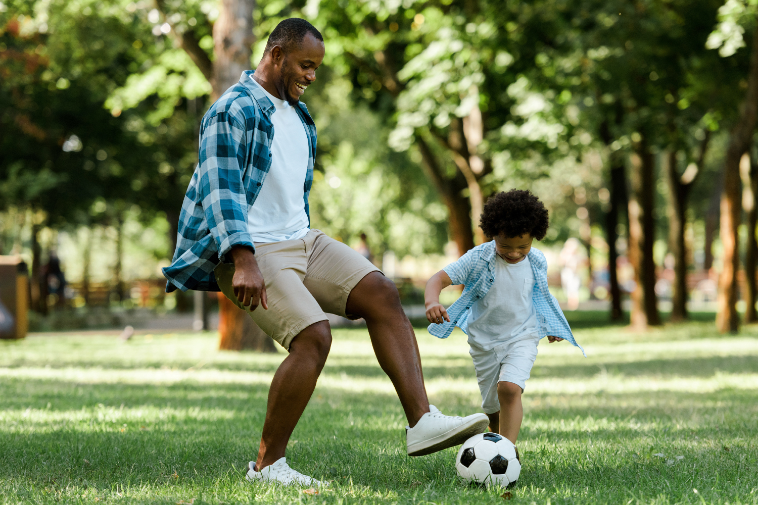 a man playing a game of frisbee in a park